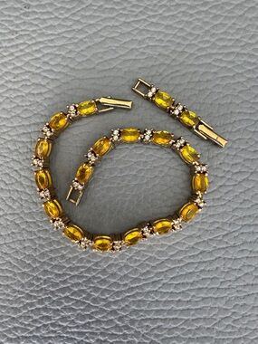 AVON GOLD TONE YELLOW CITRINE AND DIAMOND TENNIS BRACELET WITH EXTENDER
